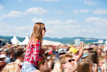 Teenagers at summer music festival enjoying themselves