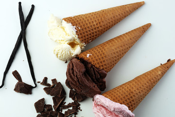 three scoops of ice cream - vanilla, strawberry and chocolate