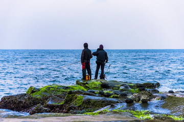 Fishermen fishing in the ocean