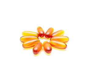 Medical pills, capsules or supplements for treatment and health care in form of flower on white background.