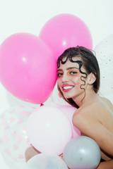 Happy pretty girl with party balloons