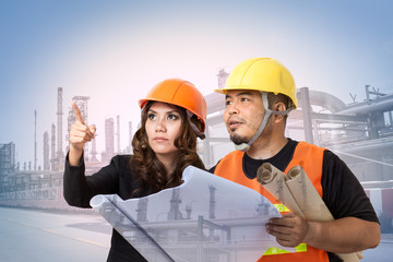 Construction engineers or architects inspect building site of factory