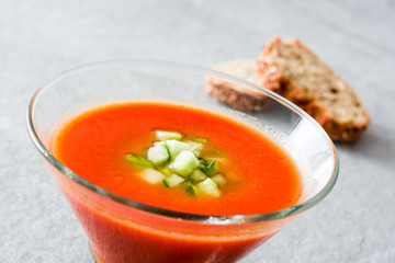 Traditional Spanish cold gazpacho soup on gray stone.
