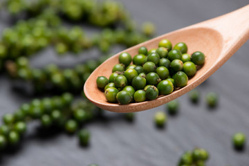 Fresh green pepper on dark background.
