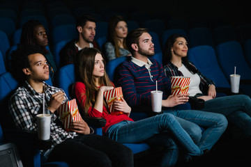Obraz premium Watching a drama movie in the cinema