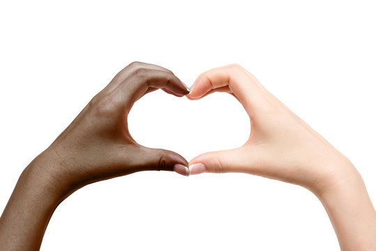 Female hands show heart on white background.