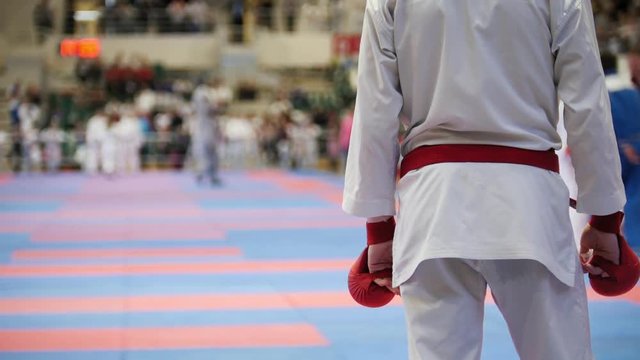 Sports teenagers - kid sportsmen at karate tatami - ready for fight