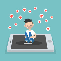 Upset crying bearded man sitting on the mobile's screen and hugging his knees surrounded by the dislike symbols / editable flat vector illustration, clip art