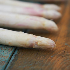 White asparagus on the colorful bread.