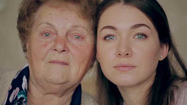 Grandmother with granddaughter face to face.