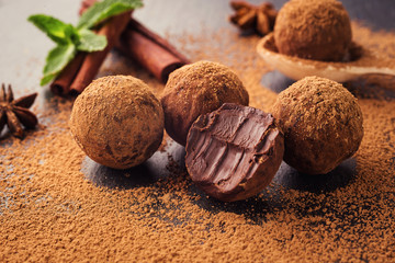 Chocolate truffle,Truffle chocolate candies with cocoa powder.Homemade fresh energy balls with chocolate.Gourmet assorted truffles made by chocolatier.Chunks of chocolate and coffee beans