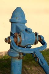 old blue public water pump