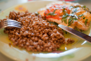 Buckwheat with chicken breast on the plate