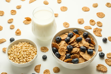 Healthy food. Multi grain flakes with blueberry and milk for breakfast.