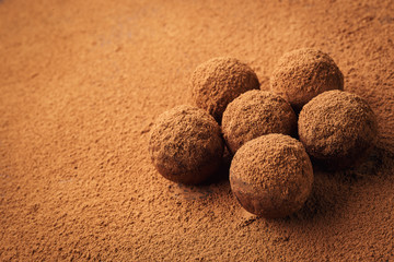 Chocolate truffle,Truffle chocolate candies with cocoa powder.Homemade fresh energy balls with chocolate.Gourmet assorted truffles made by chocolatier.Chunks of chocolate and coffee beans