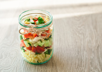 salad vegetables in a glass jar. healthy eating concept