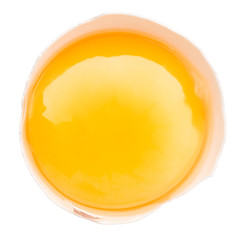 A broken chicken egg lies on a white background with a shell, yolk and spilled protein, isolated
