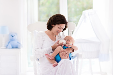 Mother and baby in bedroom