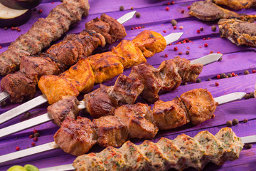Allsorts from shish kebabs, are served on skewers with sauce and spices