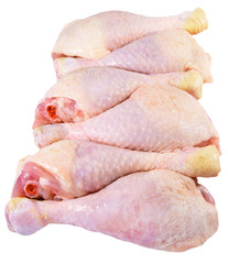 Six raw chicken legs isolated on a white background
