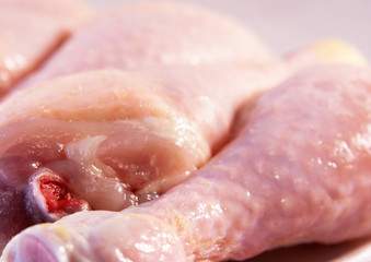 Raw chicken legs close up image