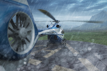 Hubschrauber auf Landeplatz bei Regen © VanHope