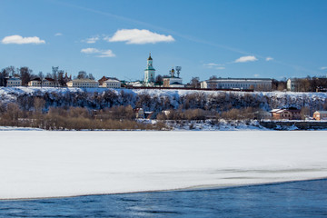 Naklejka premium The river is covered with melting ice on a sunny spring day