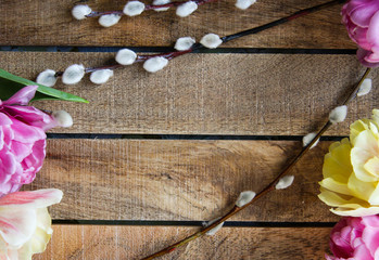 Easter wooden background with flowers  and willow 15