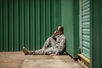 Military soldier talking on mobile phone