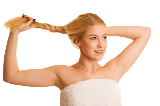 Cute blond woman holding her ahir as conceptual photo for strong hair