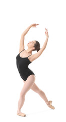 Obraz premium Young beautiful ballerina dancing on white background
