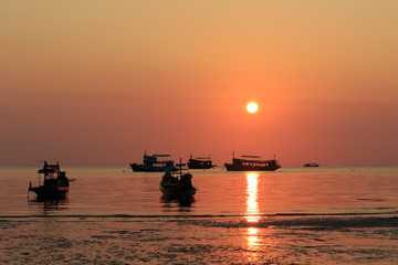 Naklejka premium Long Tail boats at Koh Tao Thailand at sunset