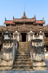 Stone stairs and wooden Shwenandaw Monastery (also known as Golden Palace Monastery) in Mandalay, Myanmar (Burma). Viewed from the front.
