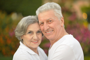 Happy elderly couple embracing