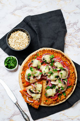 Sweet potato pizza crust with tomato, red onion and mushrooms