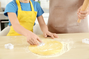 Father and son cooking together in kitchen