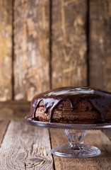 Homemade chocolate cake on glass cakestand