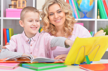 Fototapeta premium Mom and son doing lessons 