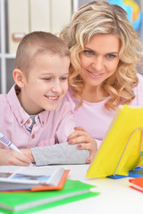 Fototapeta premium Mom and son doing lessons 