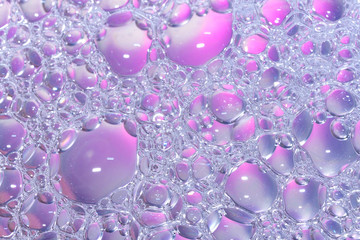Soap foam bubbles close-up. The texture of foam bubbles. Soap bubbles are round.