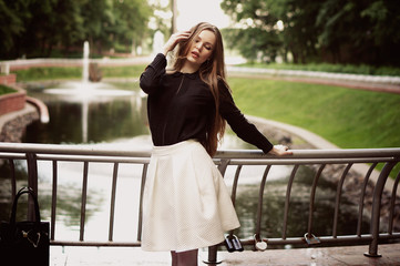 Woman enjoying her time in Europe park with background sunset