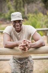 Military man standing during obstacle course in boot camp