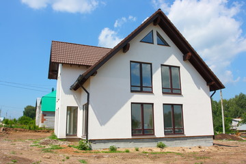 Modern cottage against a blue sky