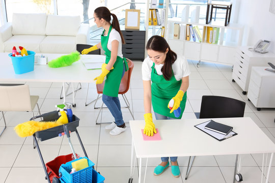 Cleaning service team at work in office