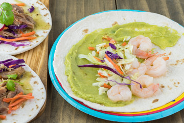 Shrimp taco with guacamole.