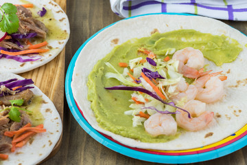 Shrimp taco with guacamole.