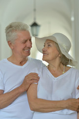 Happy elderly couple embracing