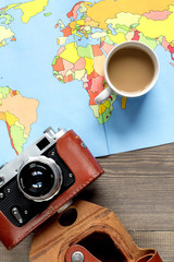 tourist lifestyle with map and camera wooden table background top view