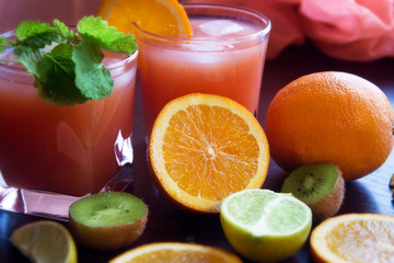 Fresh juice with fruits on table