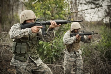 Fototapeta premium Military soldiers during training exercise with weapon